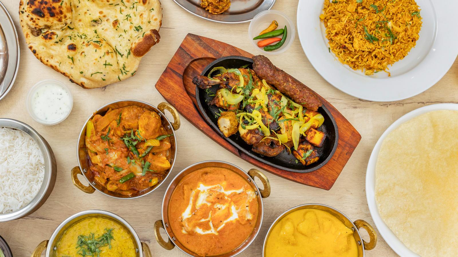 Tandoori-style grilled food with onions and vegetables
